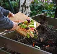 A high-tech fully automatic composting machine in a modern Abu Dhabi urban setting showing a digital price chart.